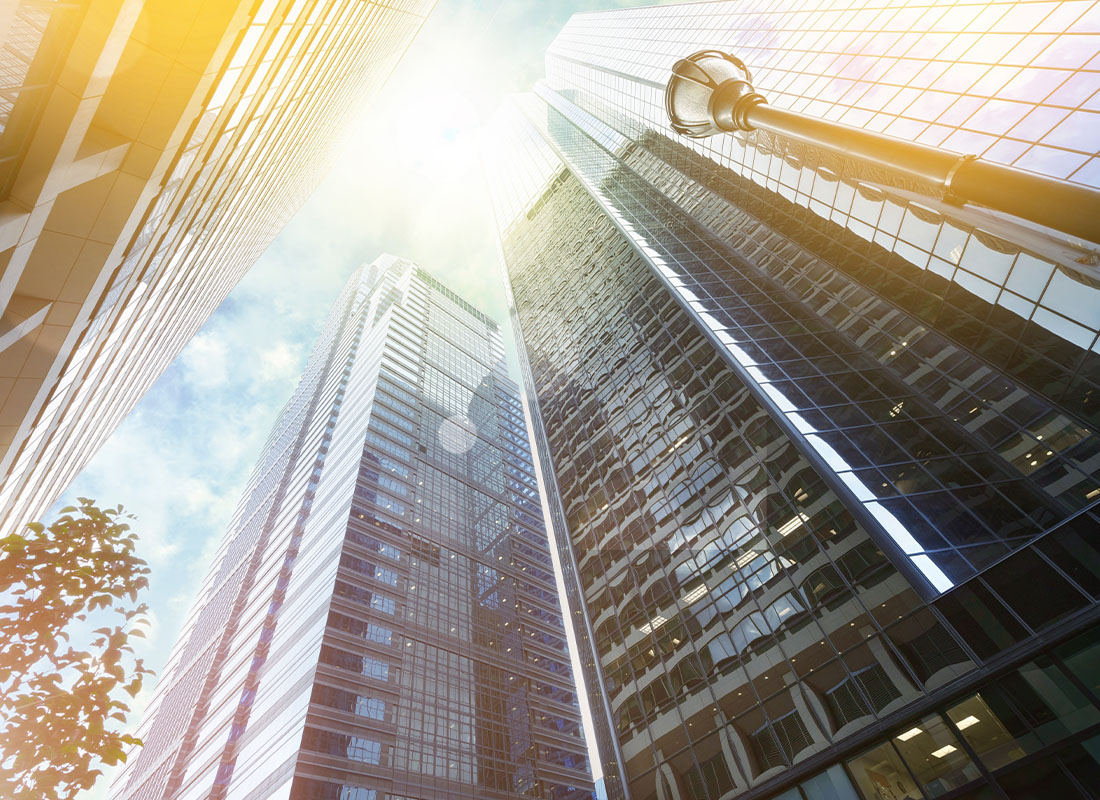 Business Insurance - Angled View of Tall Buildings Looking Up